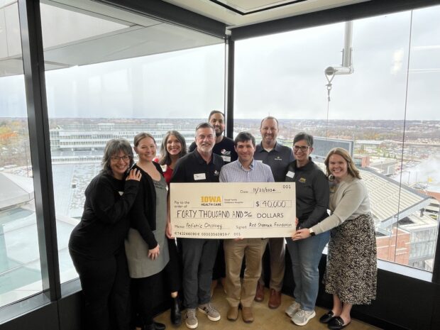 RSF Board with donation check in Children's Hospitoal